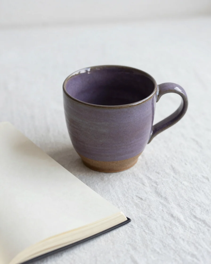 Soft morning daylight gently illuminating a handmade ceramic mug